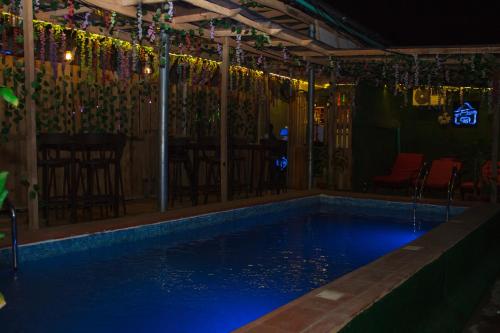 a swimming pool at night with lights on it at Go2Hotel45 in Lagos