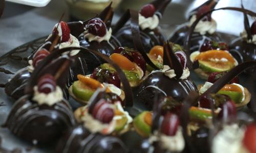 a plate of chocolate covered fruits and vegetables at El Mehdi Beach Resort ex Primasol El Mehdi in Mahdia
