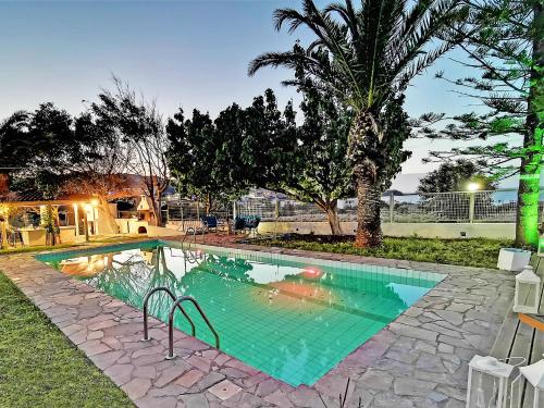 a swimming pool in the backyard of a house at Gal House in Bali