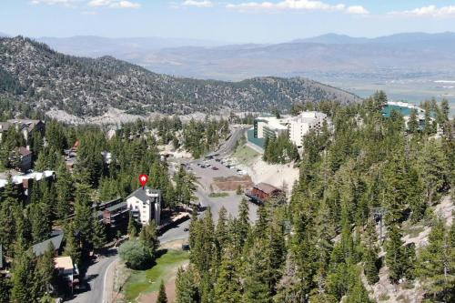 an aerial view of a mountain with a building and trees at Heavenly Chairview Condo home in Stateline