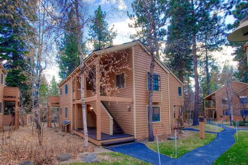 a large wooden house in the woods at Delightful McCloud condo in Incline Village