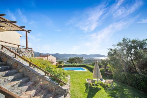 a villa with a swimming pool and a patio at Sissi Hills Villa in Sissi