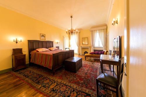 a bedroom with a bed and a living room at Castello degli Angeli in Carobbio degli Angeli