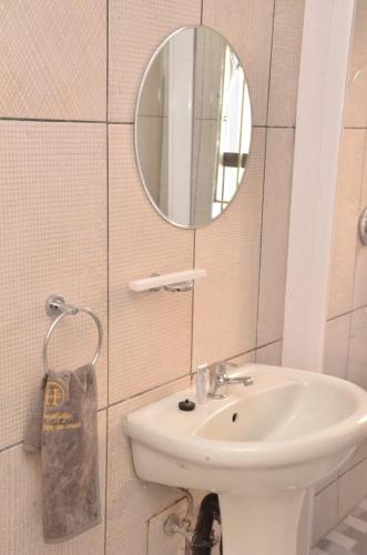 a bathroom with a sink and a mirror at High BnBGuestlodge in Johannesburg