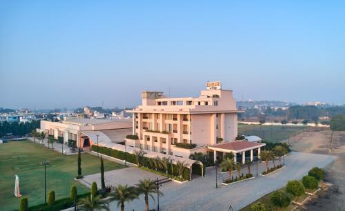 an aerial view of a building with palm trees at Enrise By Sayaji Rau Indore in Indore