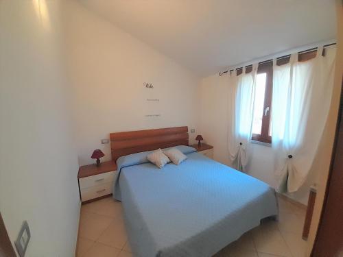Postel nebo postele na pokoji v ubytování Nuova valmar I Ginepri "Lorenzo" Vista mare