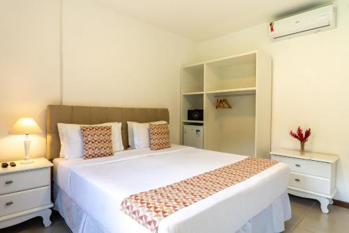 Ένα ή περισσότερα κρεβάτια σε δωμάτιο στο Le Village Boutique Hotel