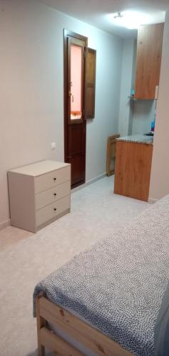 A bed or beds in a room at Coqueto Estudio 1