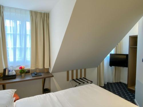 Un ou plusieurs lits dans un hébergement de l'établissement Best Western Royal Hotel Caen