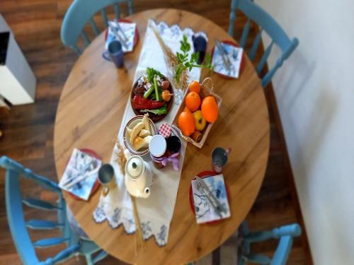 a wooden table with food on top of it at Holiday Home Paunovaca in Erdut