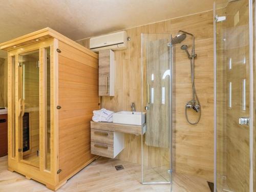 a bathroom with a shower and a sink and a toilet at Apartments Villa Kim in Jablanac