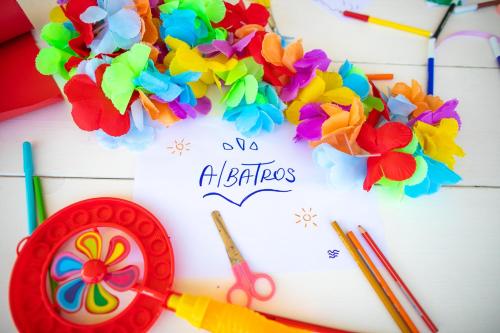 a table topped with a paper with a flower wreath at Hotel Albatros in Rimini
