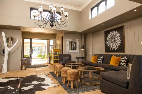 a living room with a couch and a table at Santé Wellness Retreat & Spa in Paarl