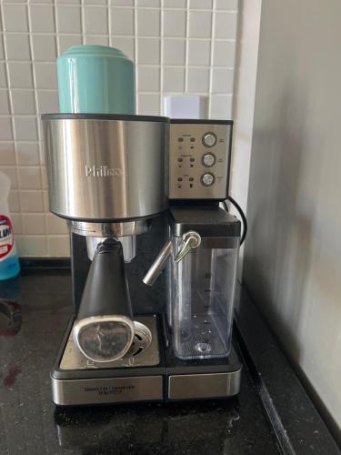 a coffee maker sitting on top of a counter at Vista mar farol da Barra in Salvador