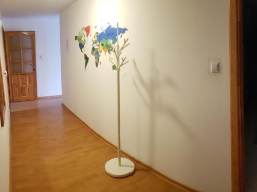 a world map on a wall in a room at Apartament AGA13 in Mikołajki