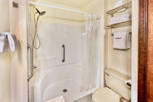 a bathroom with a shower and a toilet at The Inn at Silvercreek 633 in Granby