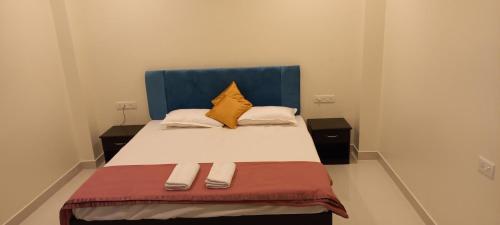מיטה או מיטות בחדר ב-Pibo Homestay