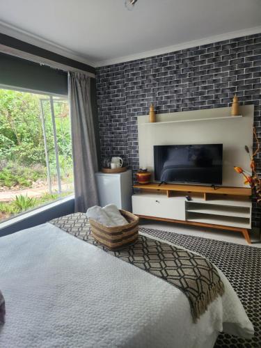 Ένα ή περισσότερα κρεβάτια σε δωμάτιο στο Phumula on St James