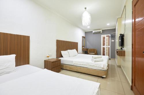 Un pat sau paturi într-o cameră la U7 P Hotel