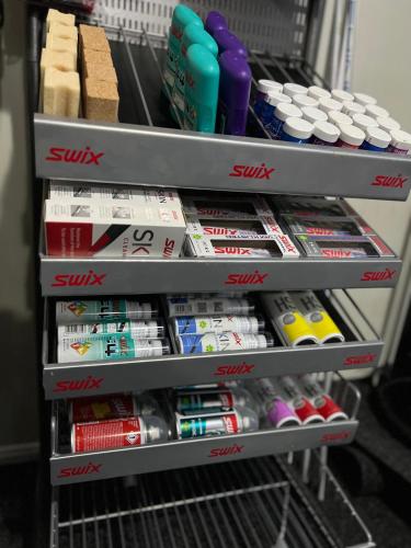 a shelf in a store filled with lots of toothpaste at Resort Pasecna in Přední Výtoň