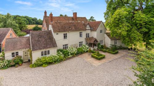 an aerial view of a house with a garden at Kington Grange in Claverdon