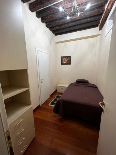 a bedroom with a bed in a room at Ormesini Apartment in Venice