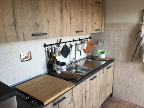 a kitchen with a sink and a counter top at G&G Apartment in Bologna