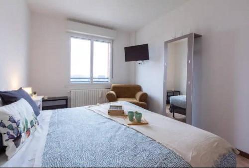 En eller flere senge i et værelse på G&G Apartment