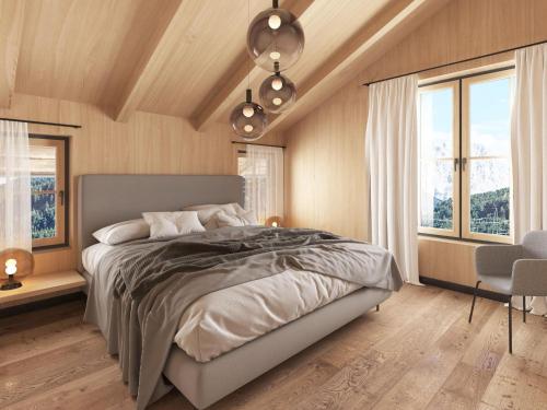 a bedroom with a large bed and two windows at Cosy, new chalet with garden and private sauna in Bichlbach