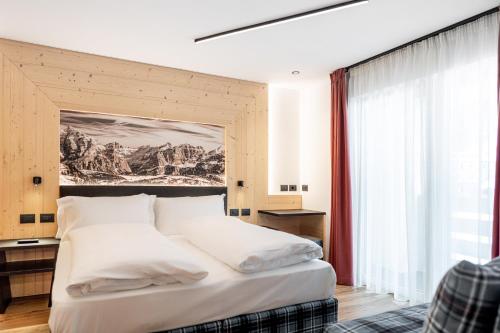 Ein Bett oder Betten in einem Zimmer der Unterkunft Albergo Garni Edy (B&B)