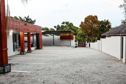 a parking lot in front of a building at Cascades Guest Lodge in Nelspruit