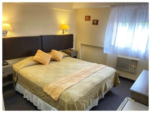 Ένα ή περισσότερα κρεβάτια σε δωμάτιο στο San Marco Hotel