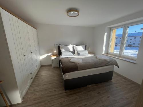 Un pat sau paturi într-o cameră la Apartmán MD