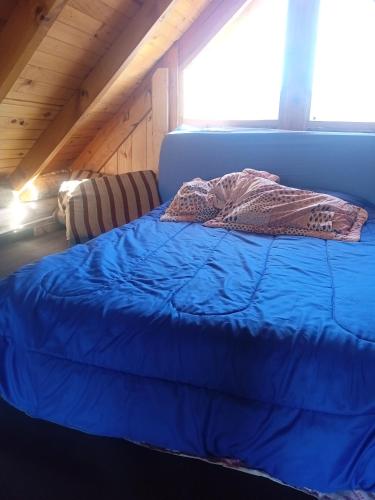 Una cama o camas en una habitación de Cabañas Don Luis