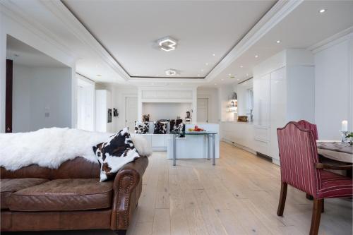 a kitchen and living room with a couch and a table at LD1000 ,Lough Dan in Carraigeenshinna
