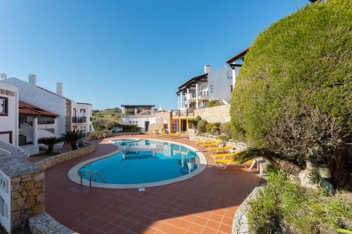 an image of a swimming pool in a resort at Surf- Com vista para o Oceano in São Martinho do Porto