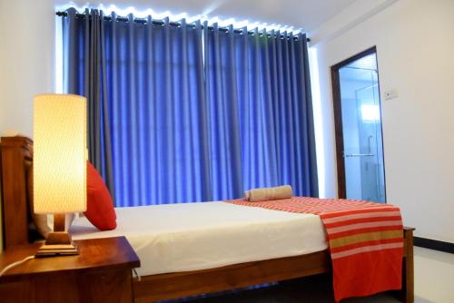 Postel nebo postele na pokoji v ubytování Cozy Homestay Kandy
