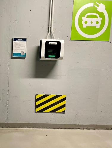 a wall with a pay phone and signs on it at Hermitage Hotel Prague in Prague