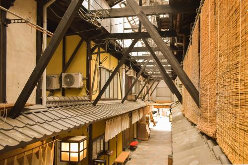 a view of an industrial building with a ceiling at Toyooka guesthouse Hostel Act in Toyooka