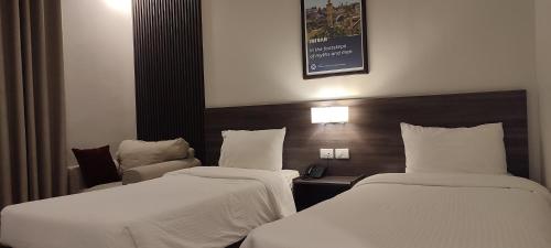 Black Iris Hotel IIにあるベッド