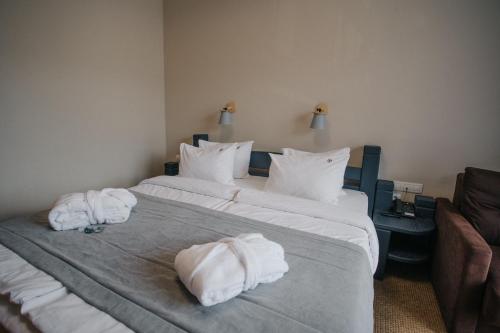 Säng eller sängar i ett rum på RUBEL APARTHOTEL&SPA