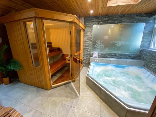 a large aquarium in a room with a bedroom at Glan Aber Hotel in Betws-y-coed
