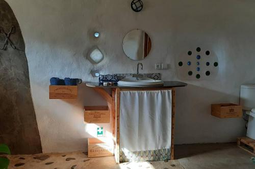 a bathroom with a sink and a mirror at Quinta Terramadome: Dome incomum & responsável in Penamacor