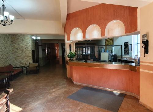 a lobby of a restaurant with a bar at HOTEL POSADA DE LA MONEDA in Zacatecas