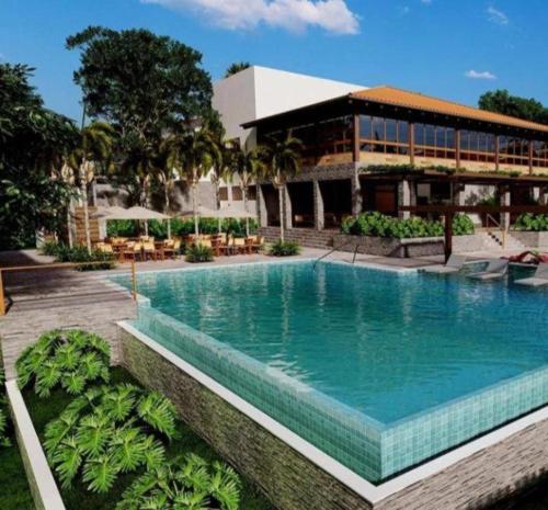 a large swimming pool in front of a building at Resort Quinta Santa Barbara 30 dez 2025 a 06 jan 2026 in Pirenópolis