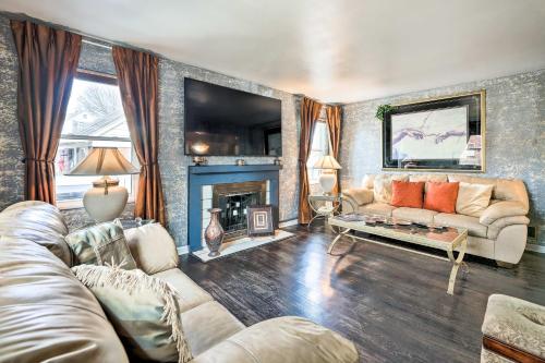 a living room with a couch and a fireplace at Pet-Friendly Dayton Vacation Rental! in Dayton