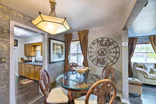 a dining room with a glass table and chairs at Pet-Friendly Dayton Vacation Rental! in Dayton