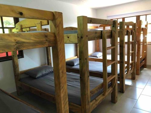 a group of bunk beds in a room at Finca la Bonita, Barbosa, Antioquia. in Barbosa