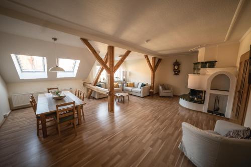 a large living room with a table and chairs at Helene in Vetschau