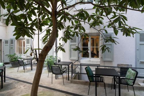 Un restaurante u otro lugar para comer en Hôtel Pax